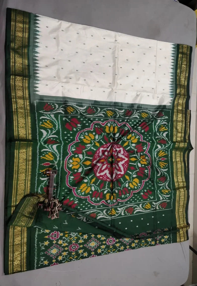 Elegant White and Green Handwoven Patola Ikkat Silk Saree - pochampallysarees.com