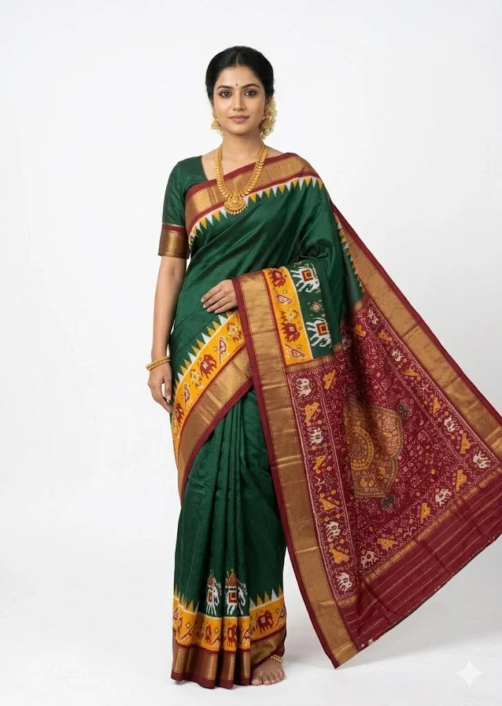 Woman wearing authentic Dark Green Pochampally Ikkat Silk Saree featuring traditional elephant motifs, maroon zari border, and handwoven silk pallu