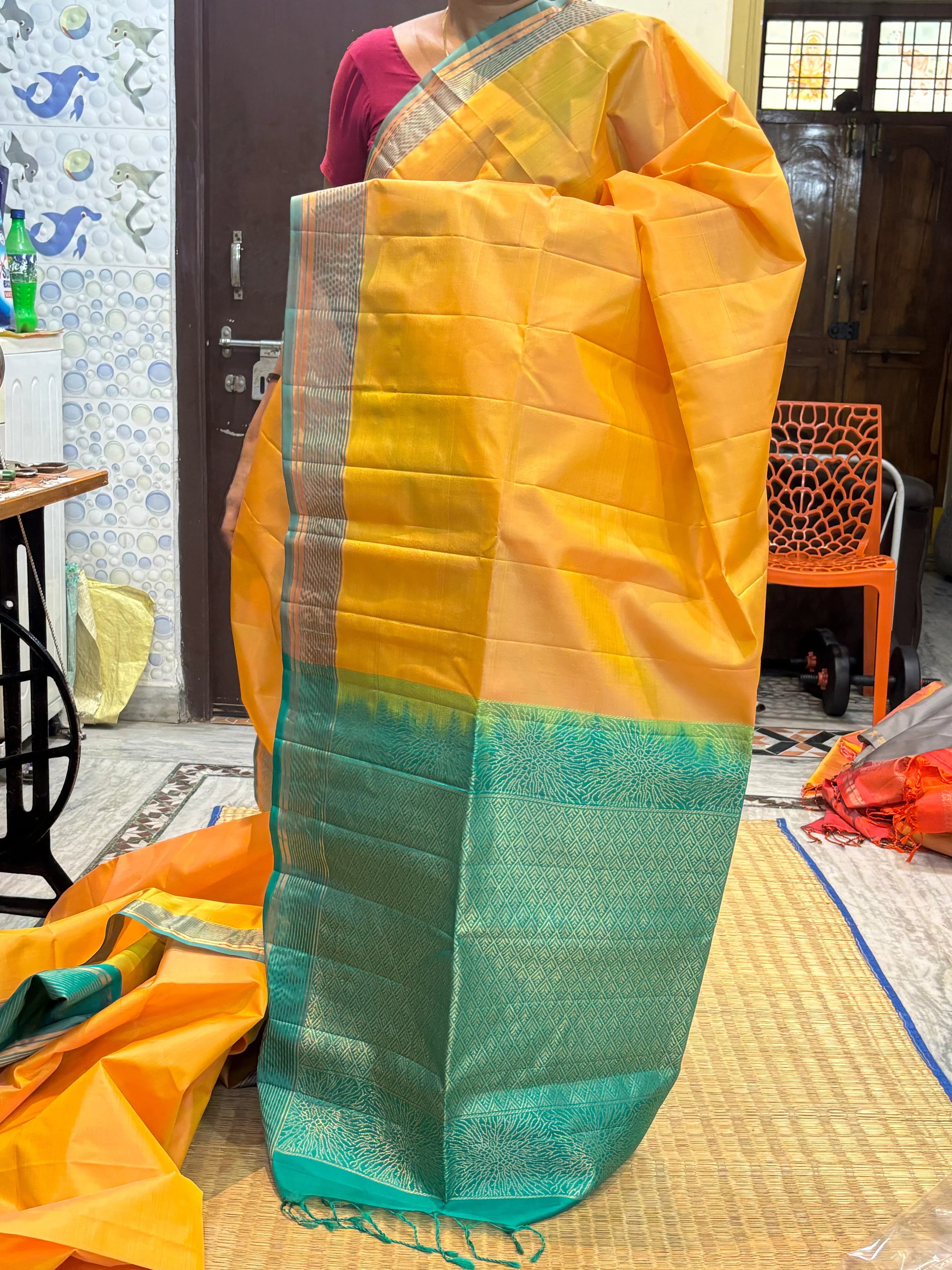 Kanchi Soft Silk Saree in Muted Gold with Teal Green Zari Border and Matching Blouse