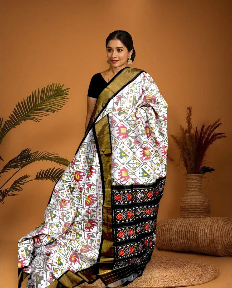 POCHAMPALLY IKKAT SILK PATOLA MIDDLE WHITE BORDER AND PALLU BLACK ZARI BORDER ALLOVER CHECKS SAREE- pa12