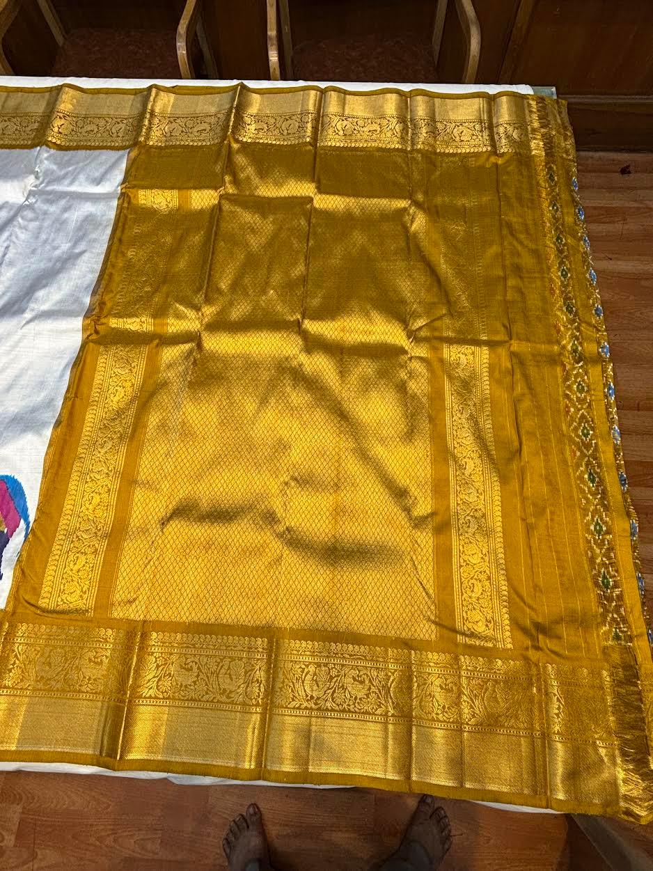 Premium Silver Kanchi Ikkat Silk Saree with Rich Gold Zari Border | Traditional Elephant Motif Pattu Saree for Weddings & Festivals - pochampallysarees.com