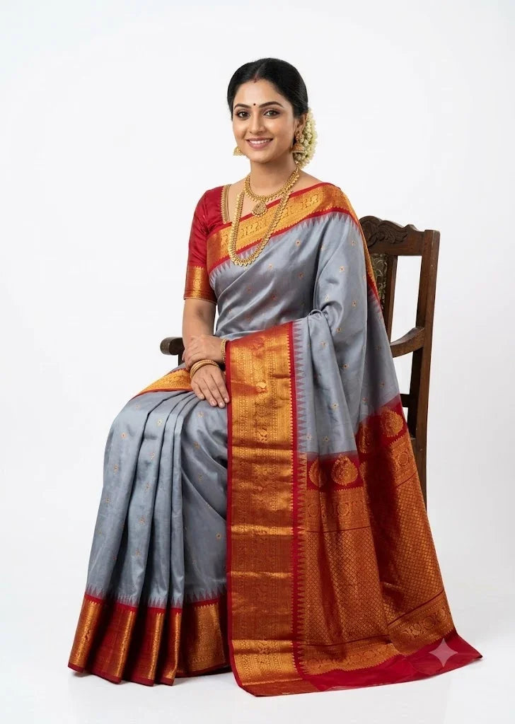 traditional gray Gadwal silk saree with a contrast red gold zari border and pallu