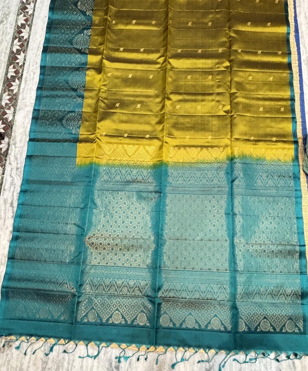 Mustard olive green Kanchipuram soft silk saree with intricate peacock teal zari pallu and Silk Mark certification