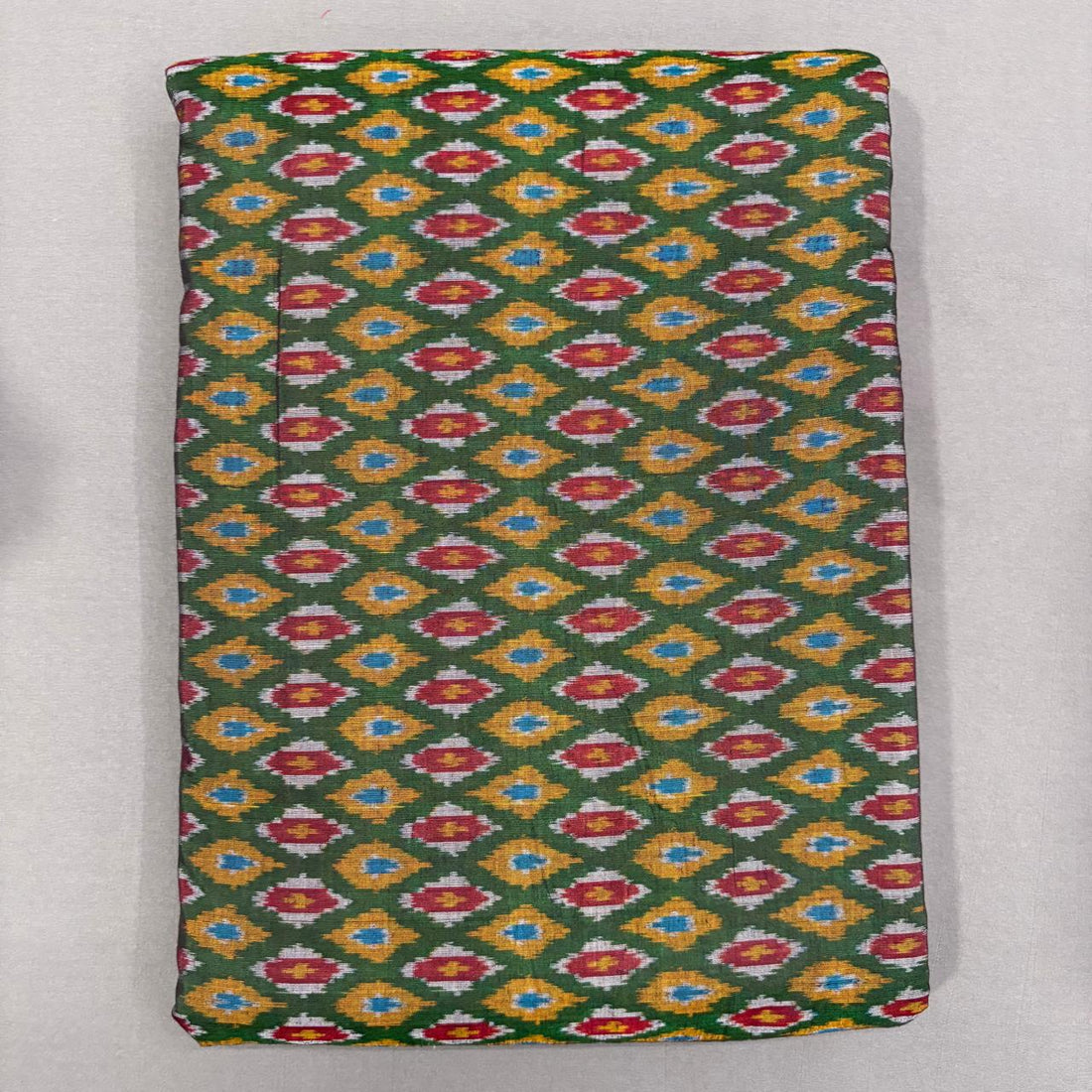 Handwoven Pochampally Ikkat Sico bottle green fabric with yellow and red diamond Ikat motifs