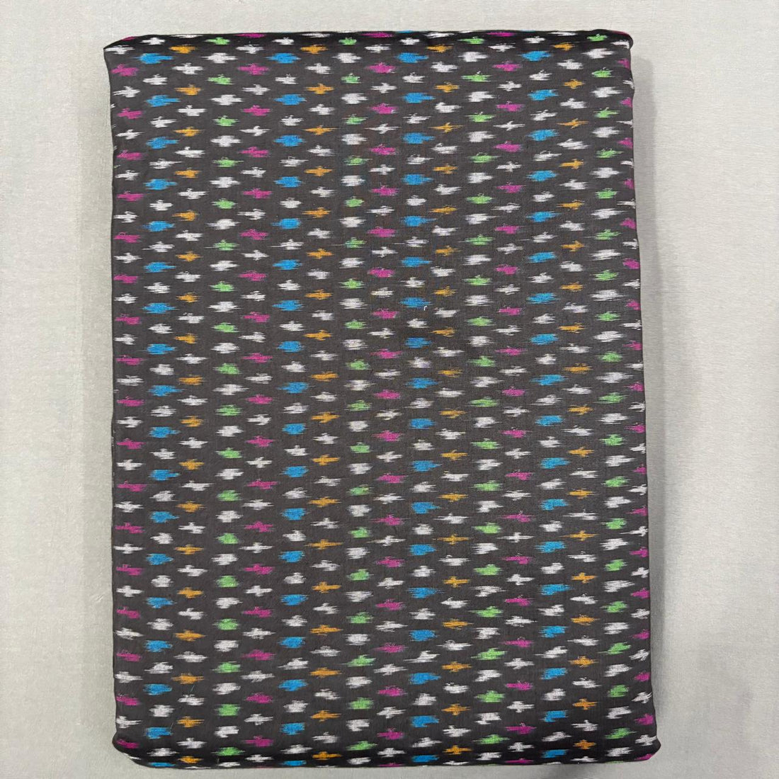Handwoven Pochampally Ikkat Sico black fabric with all-over colorful geometric buti motifs