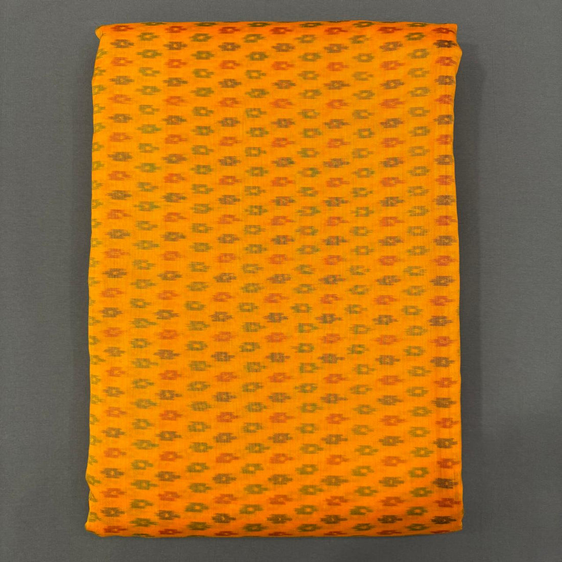 Handwoven Pochampally Ikkat Sico mustard yellow dress material fabric with all-over grey and orange buti motifs