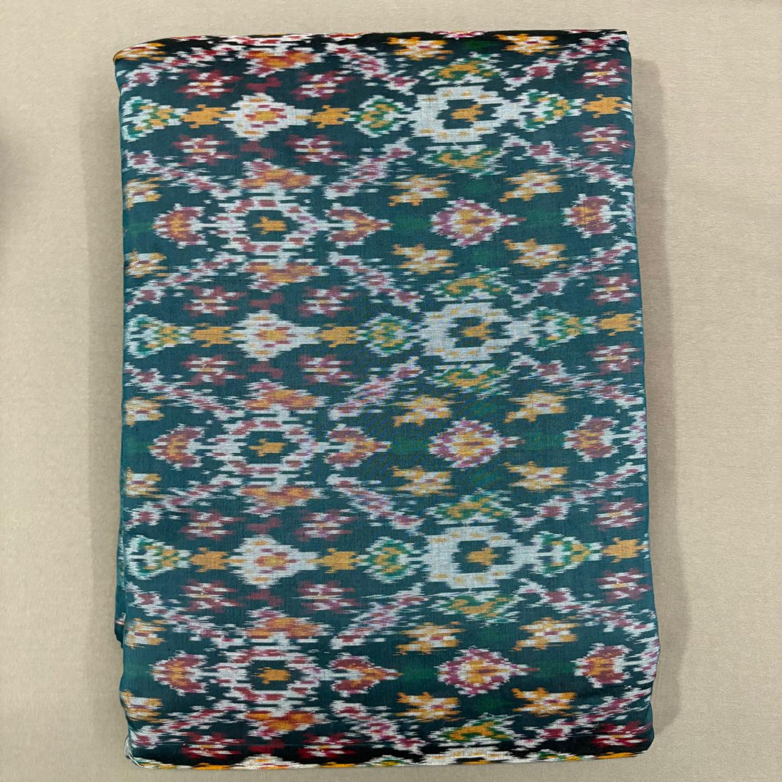 Handwoven Pochampally Ikkat Sico peacock green fabric with multicolor Patola geometric Ikat motifs