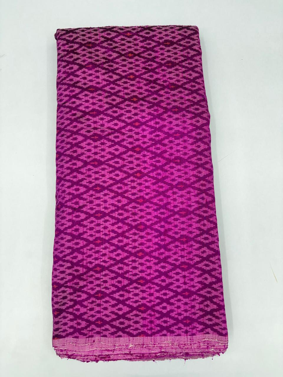 Folded bolt of magenta purple pure raw silk fabric featuring an intricate geometric diamond lattice Ikat weave with Silk Mark authenticity