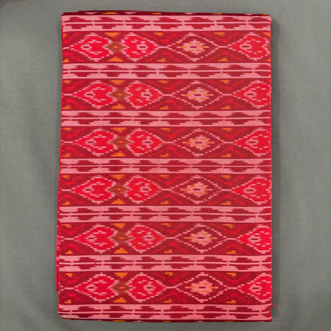 Red Pochampally ikkat sico unstitched dress material with horizontal stripes and geometric diamond patterns.