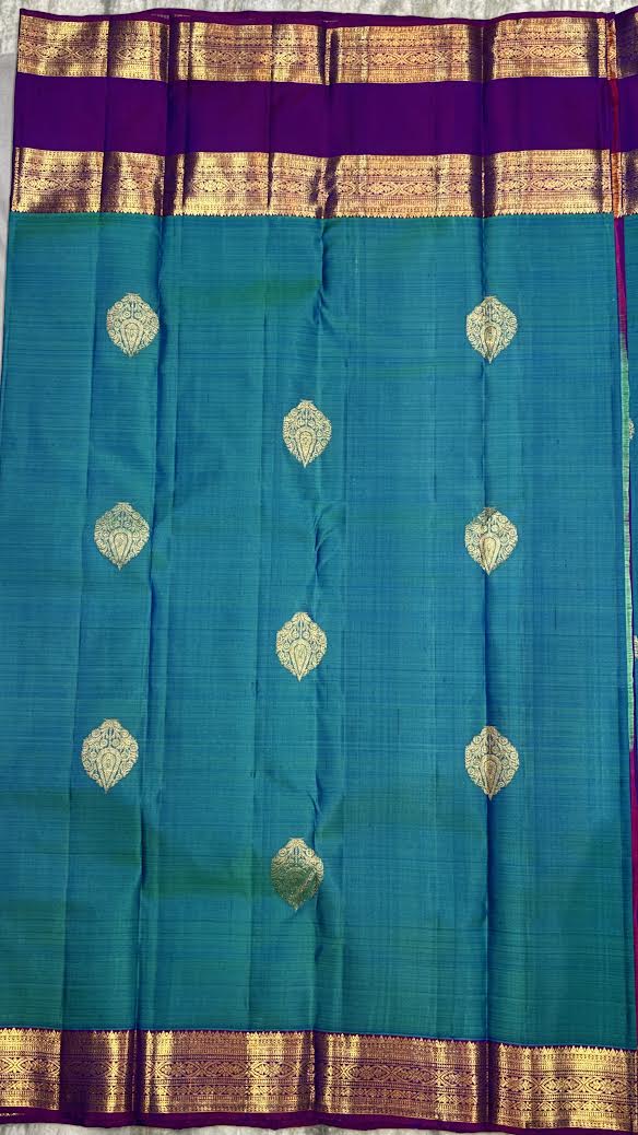 Pure Kanchipuram Pattu Saree in Teal Blue with Royal Purple Zari Pallu