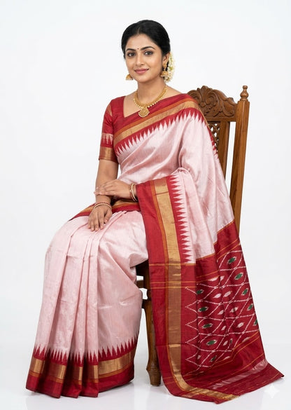 Elegance in Red and White: Traditional Indian Woman in a Phoda Temple Ikat Saree
