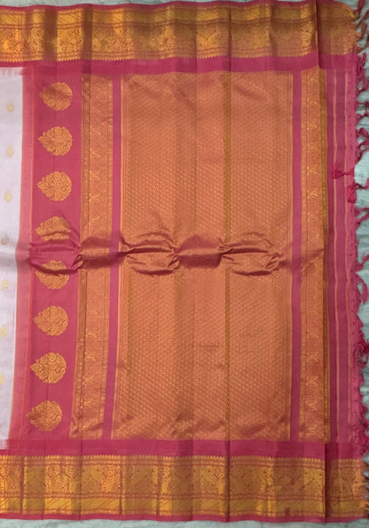 Elegant Off-White Pure Silk Saree with Contrasting Pink Zari Border and Mango Buttas
