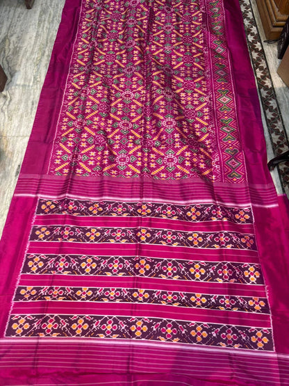 Pure Ikkat Patola Silk Saree in Magenta Pink with Plain Border | Handwoven Traditional Festive Wear - pochampallysarees.com