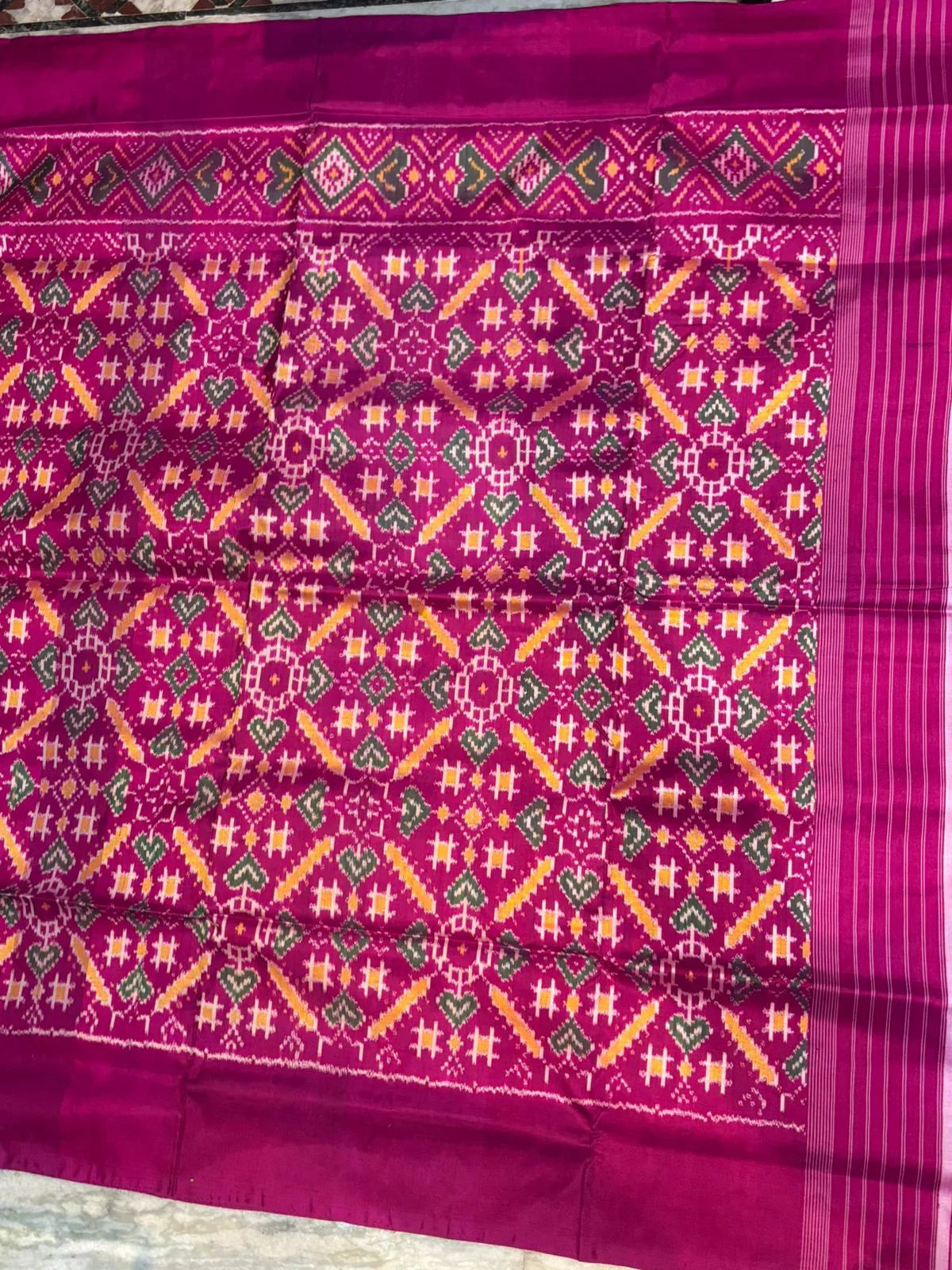 Pure Ikkat Patola Silk Saree in Magenta Pink with Plain Border | Handwoven Traditional Festive Wear - pochampallysarees.com
