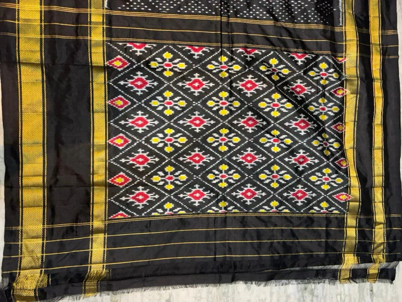 Exquisite Black Ikkat Patola Silk Saree with Rich Golden Zari Border | Silk Mark Certified - pochampallysarees.com