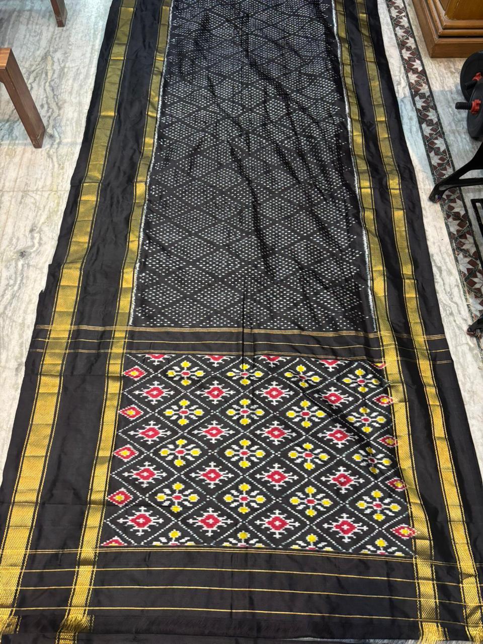 Exquisite Black Ikkat Patola Silk Saree with Rich Golden Zari Border | Silk Mark Certified - pochampallysarees.com