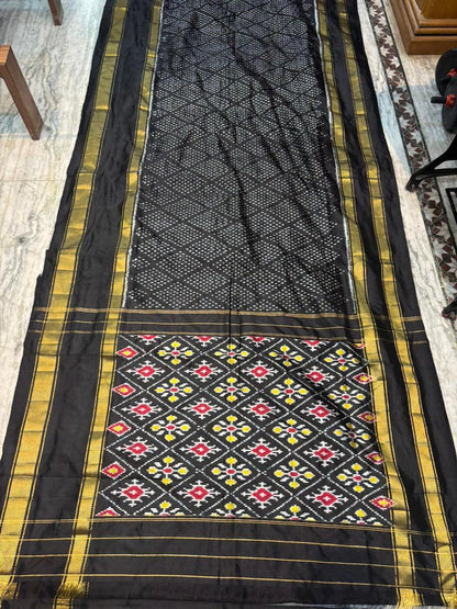 Exquisite Black Ikkat Patola Silk Saree with Rich Golden Zari Border | Silk Mark Certified - pochampallysarees.com