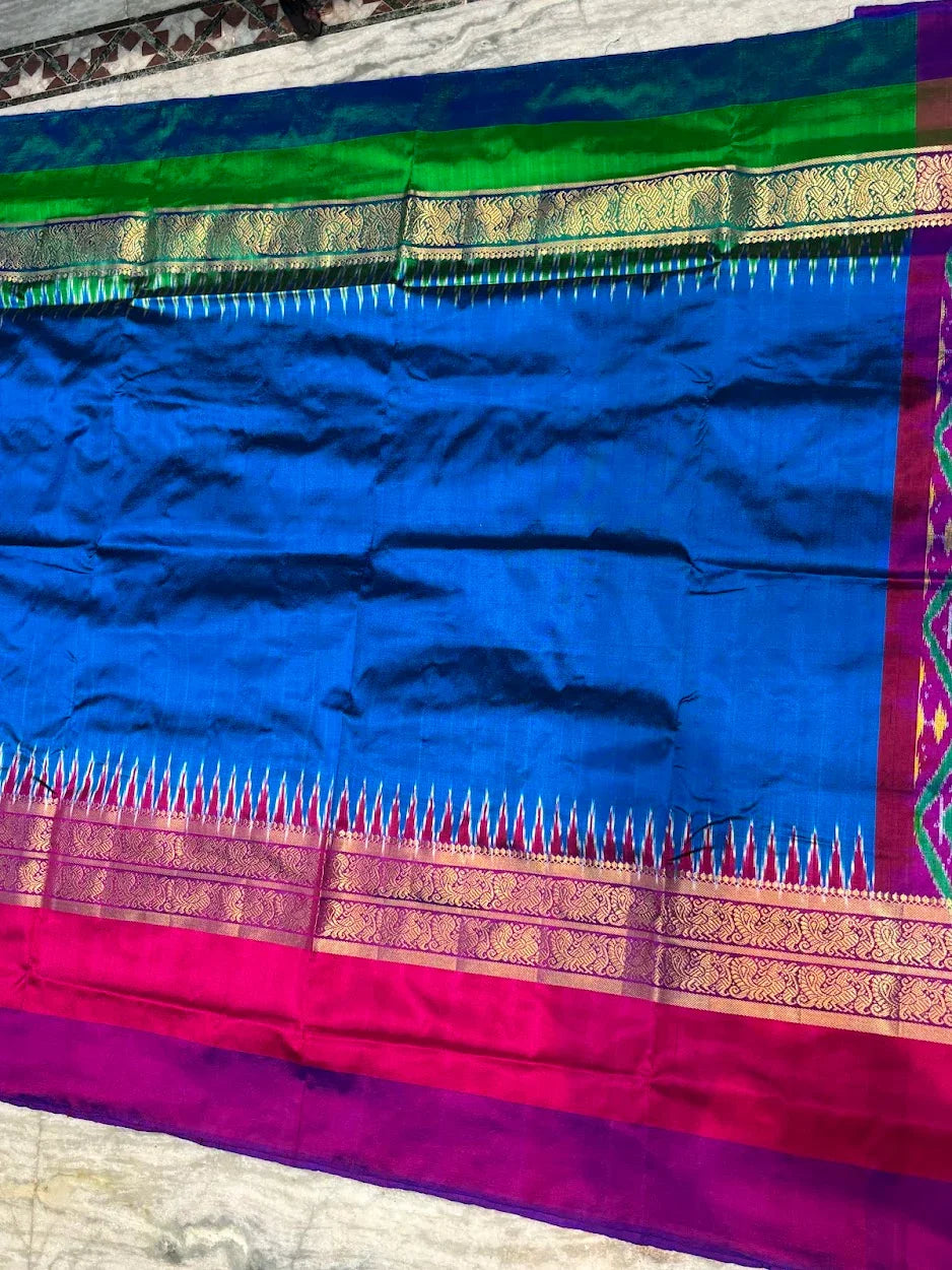 Pochampally Ikat Silk Saree – Blue Body with Ganga-Jamuna Borders (Pink &amp; Green) | Dual-Tone Handloom Classic - pochampallysarees.com