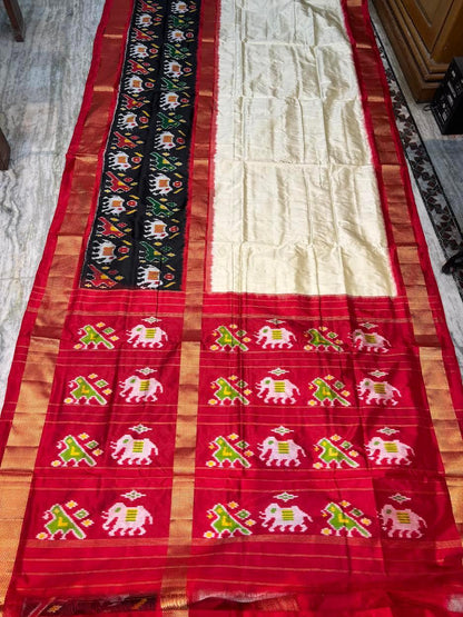 Traditional Cream &amp; Red Ikkat Silk Saree with Black Elephant Motif Border | Pochampally Handloom - pochampallysarees.com