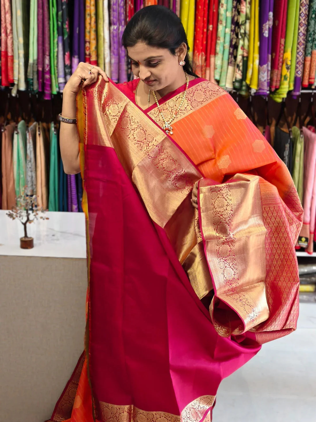 Pure kanchipuram tissue silk saree Orange with Red Checks floral design motif and long rich floral design border - pochampallysarees.com