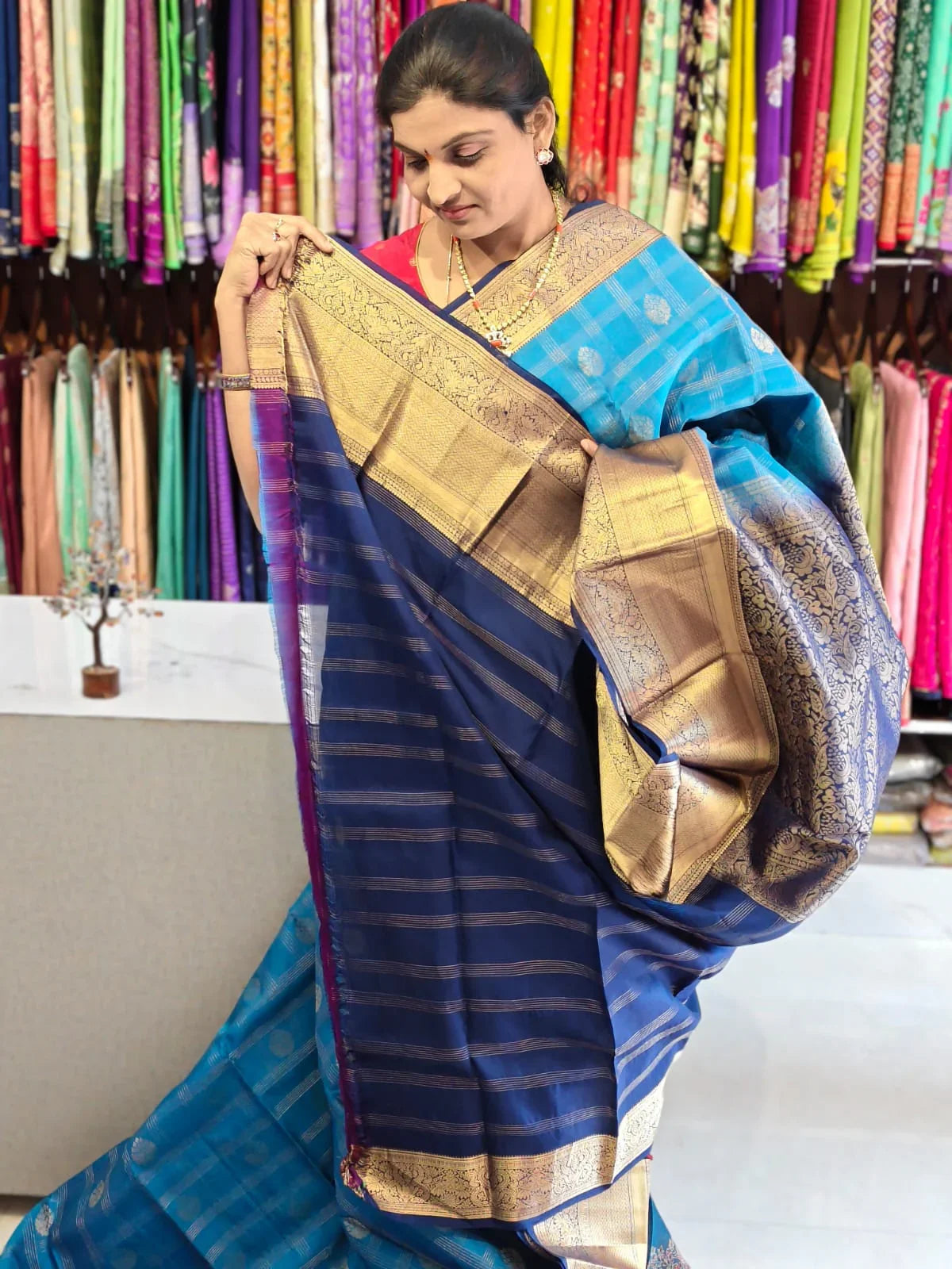 Pure kanchipuram tissue silk saree Ananda Blue with Naviblue Checks floral design motif and long rich floral design border - pochampallysarees.com
