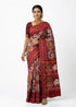 Woman wearing red Pochampally Ikkat Patola silk saree with traditional elephant and cart motifs, handwoven silk with zari border