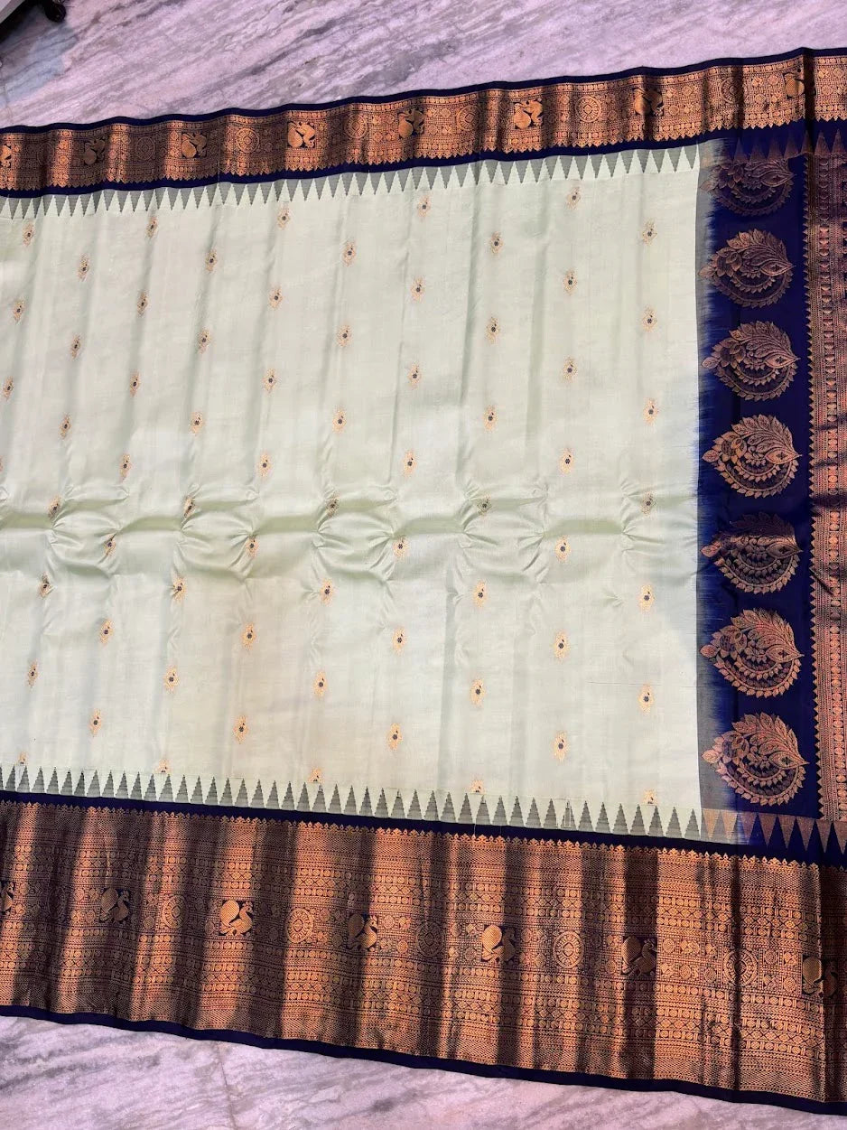 Pure Gadwal Silk Saree in Pastel Mint Green with Navy Blue Temple Border &amp; Grand Gold Zari Pallu | Traditional Handloom Wedding Saree - pochampallysarees.com
