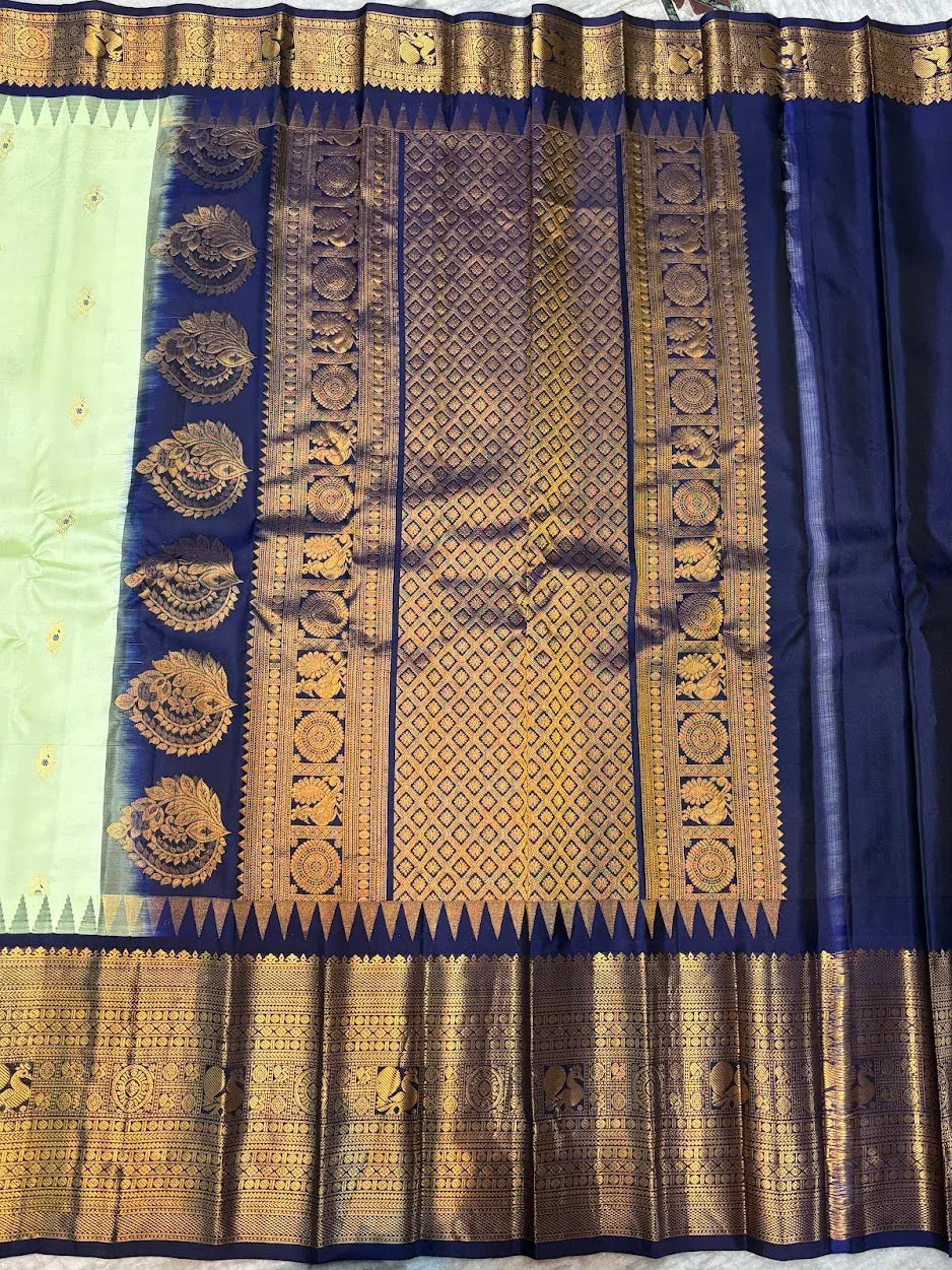 Pure Gadwal Silk Saree in Pastel Mint Green with Navy Blue Temple Border &amp; Grand Gold Zari Pallu | Traditional Handloom Wedding Saree - pochampallysarees.com