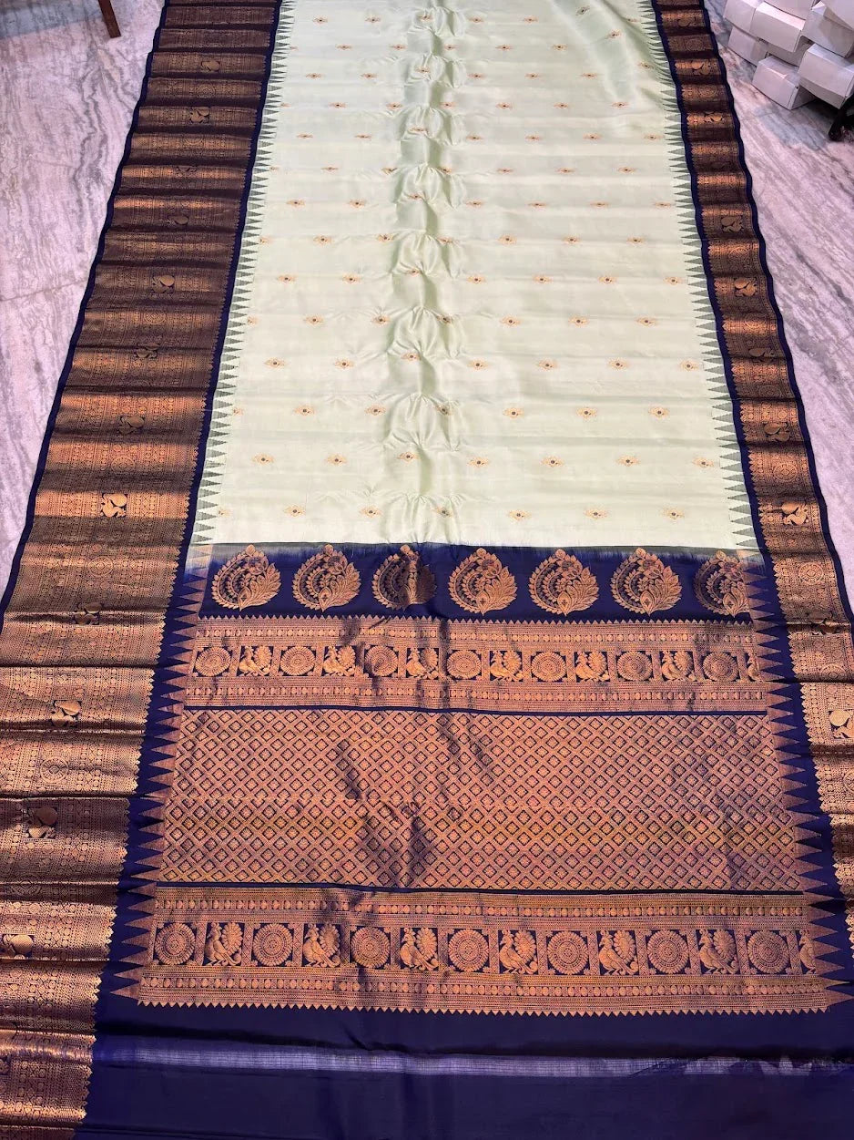 Pure Gadwal Silk Saree in Pastel Mint Green with Navy Blue Temple Border &amp; Grand Gold Zari Pallu | Traditional Handloom Wedding Saree - pochampallysarees.com