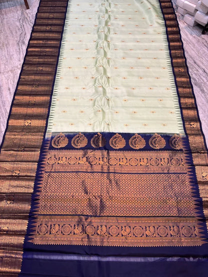 Pure Gadwal Silk Saree in Pastel Mint Green with Navy Blue Temple Border &amp; Grand Gold Zari Pallu | Traditional Handloom Wedding Saree - pochampallysarees.com