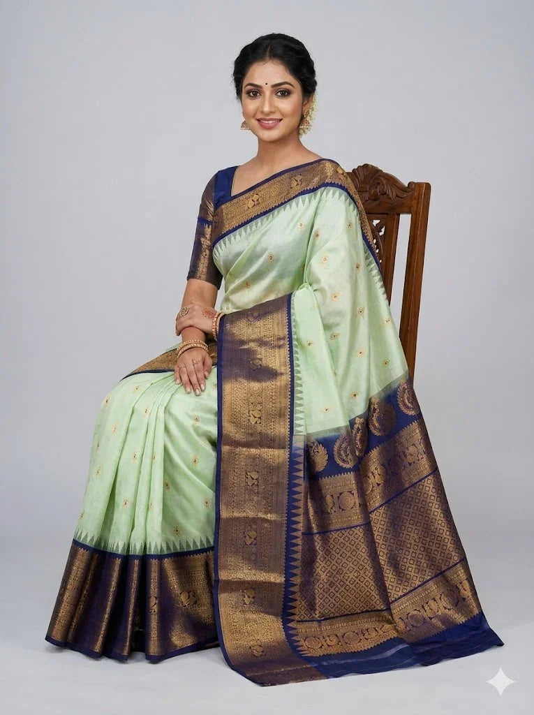 Pure Gadwal Silk Saree in Pastel Mint Green with Navy Blue Temple Border &amp; Grand Gold Zari Pallu | Traditional Handloom Wedding Saree - pochampallysarees.com
