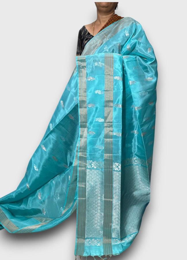 PURE SOFT SILK SAREE ANANDA BLUE WITH ALLOVER ZARI WEAVES BUTTAS IN BORDER TISSUE STYLE