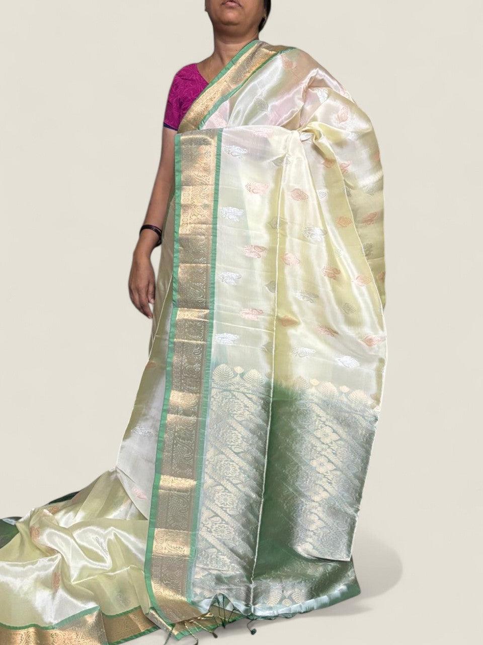 PURE SOFT SILK SAREE CREAM AND ANANDA BLUE WITH ALLOVER ZARI WEAVES BUTTAS IN BORDER TISSUE STYLE