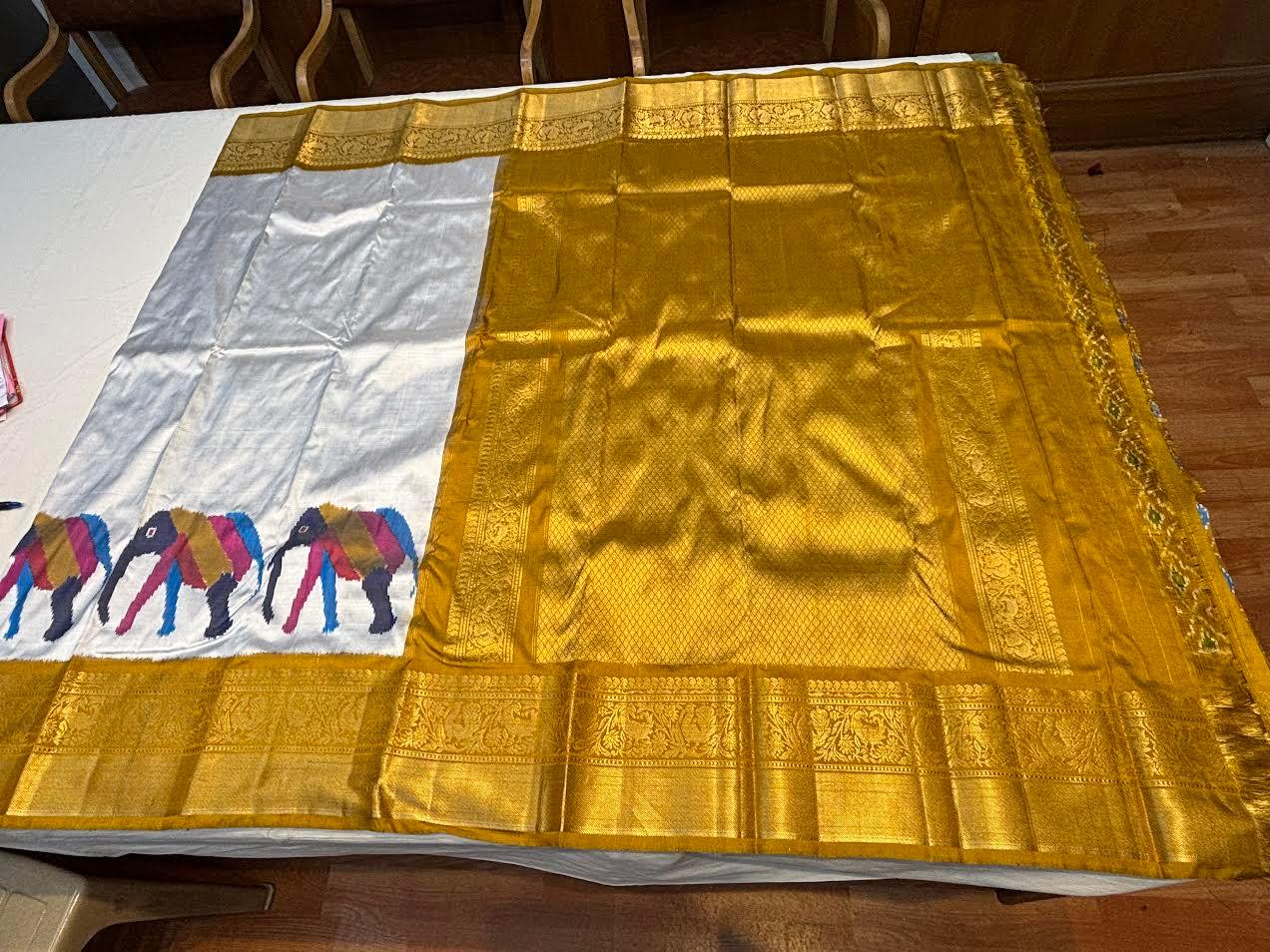 Premium Silver Kanchi Ikkat Silk Saree with Rich Gold Zari Border | Traditional Elephant Motif Pattu Saree for Weddings &amp; Festivals - pochampallysarees.com