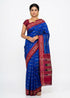 Real product view of royal blue handloom Pochampally silk saree fabric with maroon geometric ikat pattern.