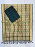 Beige and forest green Pochampally Ikat silk unstitched dress material set featuring handwoven geometric and abstract motifs, a classic temple pattern border, and black tassels.