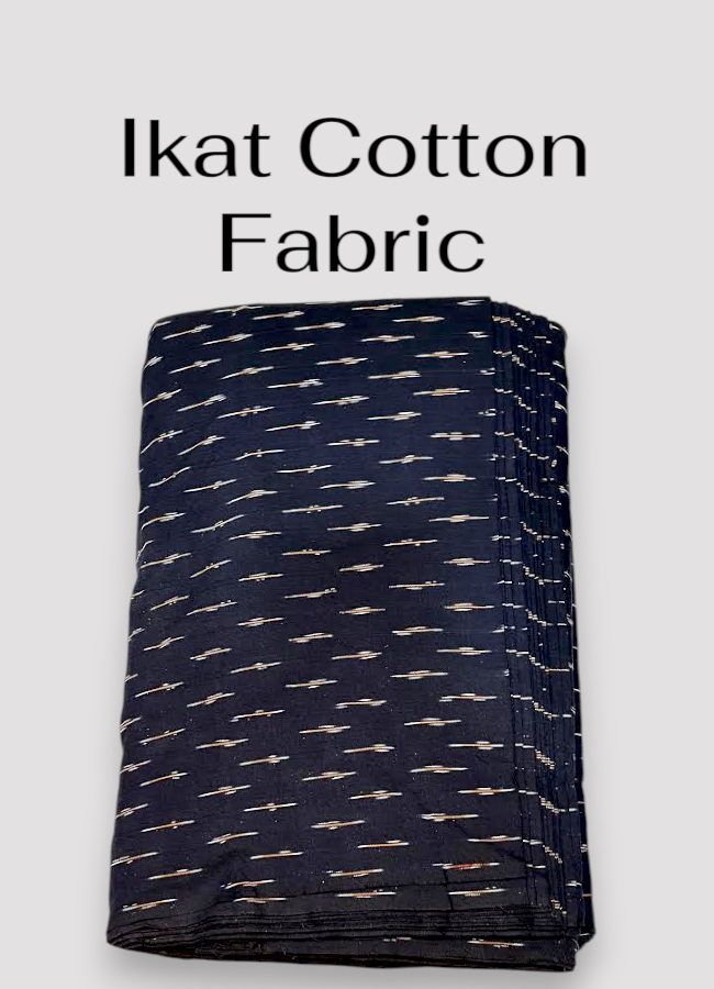 Folded black Pochampally Ikat cotton fabric featuring scattered horizontal white and reddish-brown woven dash motifs.