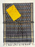 Charcoal black and yellow Pochampally Ikat silk unstitched dress material set featuring handwoven bird motifs, a detailed geometric and floral pattern border, and knotted tassels