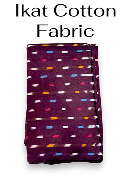 Folded dark maroon Ikat cotton fabric featuring traditional horizontal woven motifs in white, light blue, red, and mustard yellow