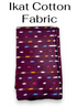 Folded dark maroon Ikat cotton fabric featuring traditional horizontal woven motifs in white, light blue, red, and mustard yellow