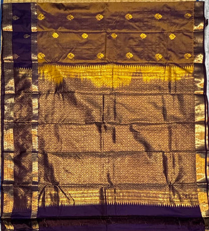 Gaada purple body mariyu intricate golden zari border, heavy pallu kaligina traditional semi Dharmavaram pattu cheera.   