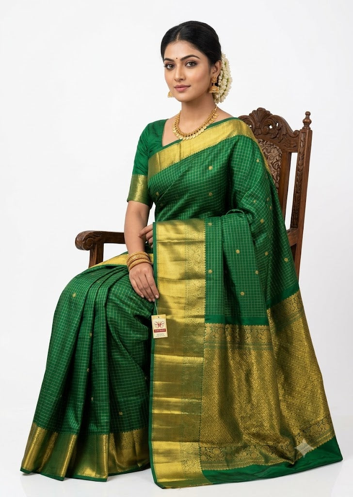 Authentic Silk Mark certified emerald green handloom Kanchi silk saree featuring fine gold checks, zari buttis, and a rich woven pallu.