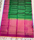 Emerald green Kanchi pattu soft silk saree with subtle zari stripes and contrast rani pink gold zari brocade pallu, Silk Mark certified