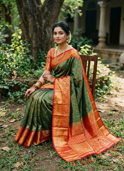 A graceful Indian woman seated in a lush traditional garden, wearing an elegant forest green and crimson red semi Dharmavaram silk saree with intricate gold zari borders and a rich brocade pallu.