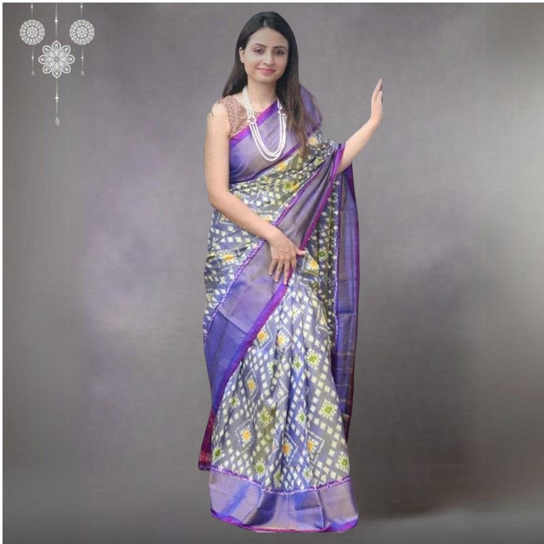 Model wearing a grey and purple handloom Pochampally Ikkat pure silk saree with geometric patterns