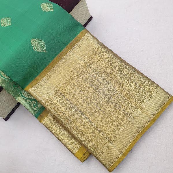 Kanchipuram Pure Silk Saree Rama Green And Yellow With Zari Woven Buttas And Long Zari Woven Kanchi Border - pochampallysarees.com