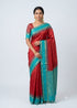 Indian model draped in a traditional Kanchipuram checks silk saree with rich gold zari border and contrast pallu