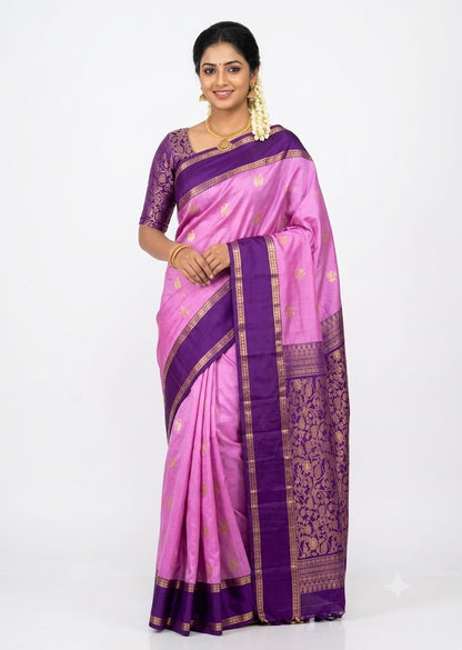 Flat lay texture view of soft pink body with rich deep purple floral zari woven pallu