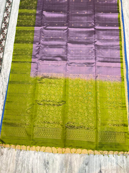 Lavender mauve Kanchi Pattu soft silk saree featuring contrast olive green floral gold zari pallu and border