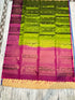 Leaf green Kanchipuram soft silk saree with contrast deep magenta geometric zari pallu and Silk Mark certification